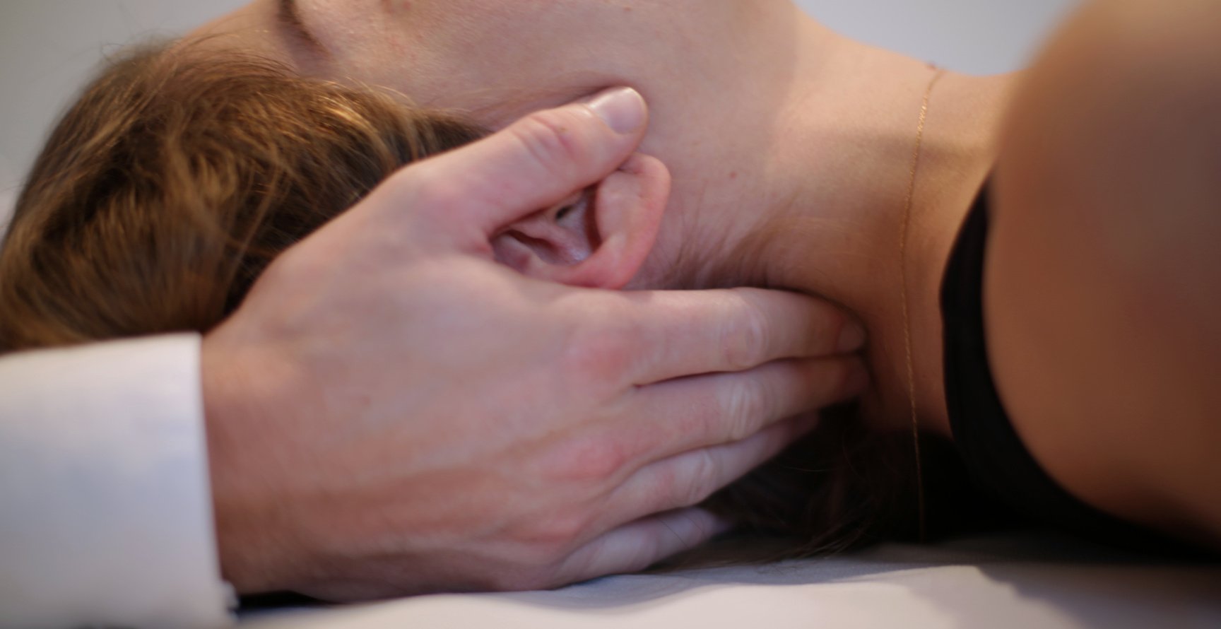 Osteopath manipulating a patient